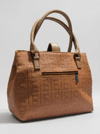 Tan brown camel textured structured tote bag for women with dual top handles and detachable crossbody strap luxury style 2026