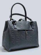 Navy blue midnight textured structured tote bag for women with dual top handles and detachable crossbody strap luxury style 2026